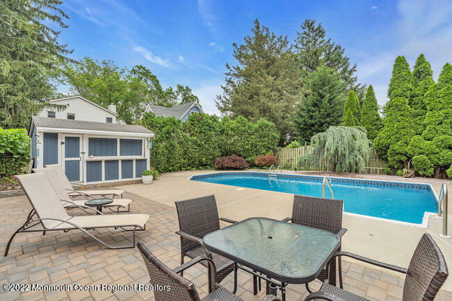 52 Morris Avenue Manasquan, NJ 08736 - Photo 18 of 20 a view of a patio with couple of chairs
