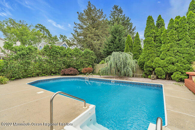 52 Morris Avenue Manasquan, NJ 08736 - Photo 2 of 20 a view of a swimming pool with a yard