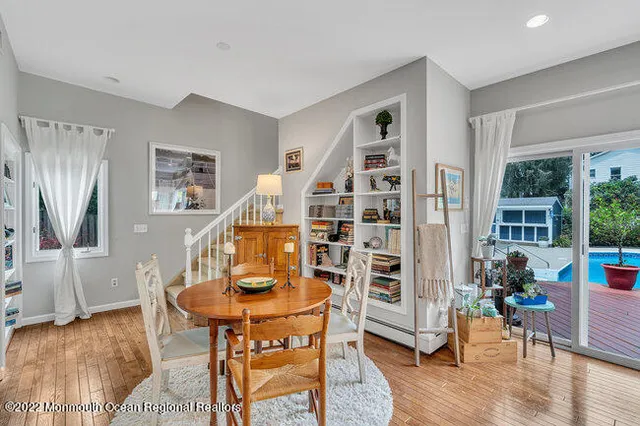 a view of a livingroom with furniture and a wooden floor