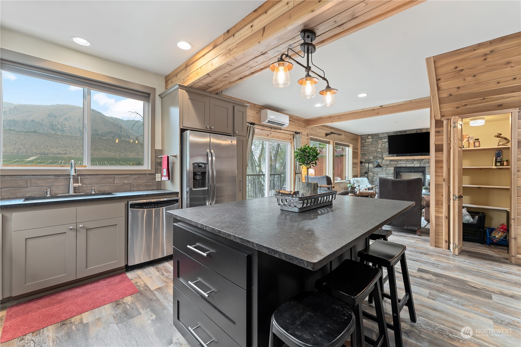 3755 Stayman Flats Road Chelan, WA 98816 - Photo 8 of 39 a kitchen with stainless steel appliances granite countertop a sink a stove and a refrigerator