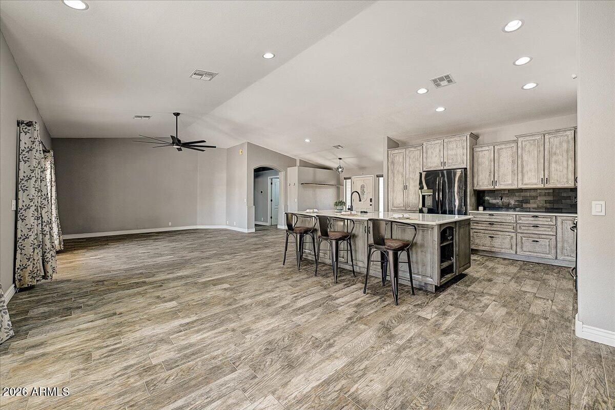 7624 North Citrus Road Waddell, AZ 85355 - Photo 12 of 57 a kitchen with lots of counter top space and appliances