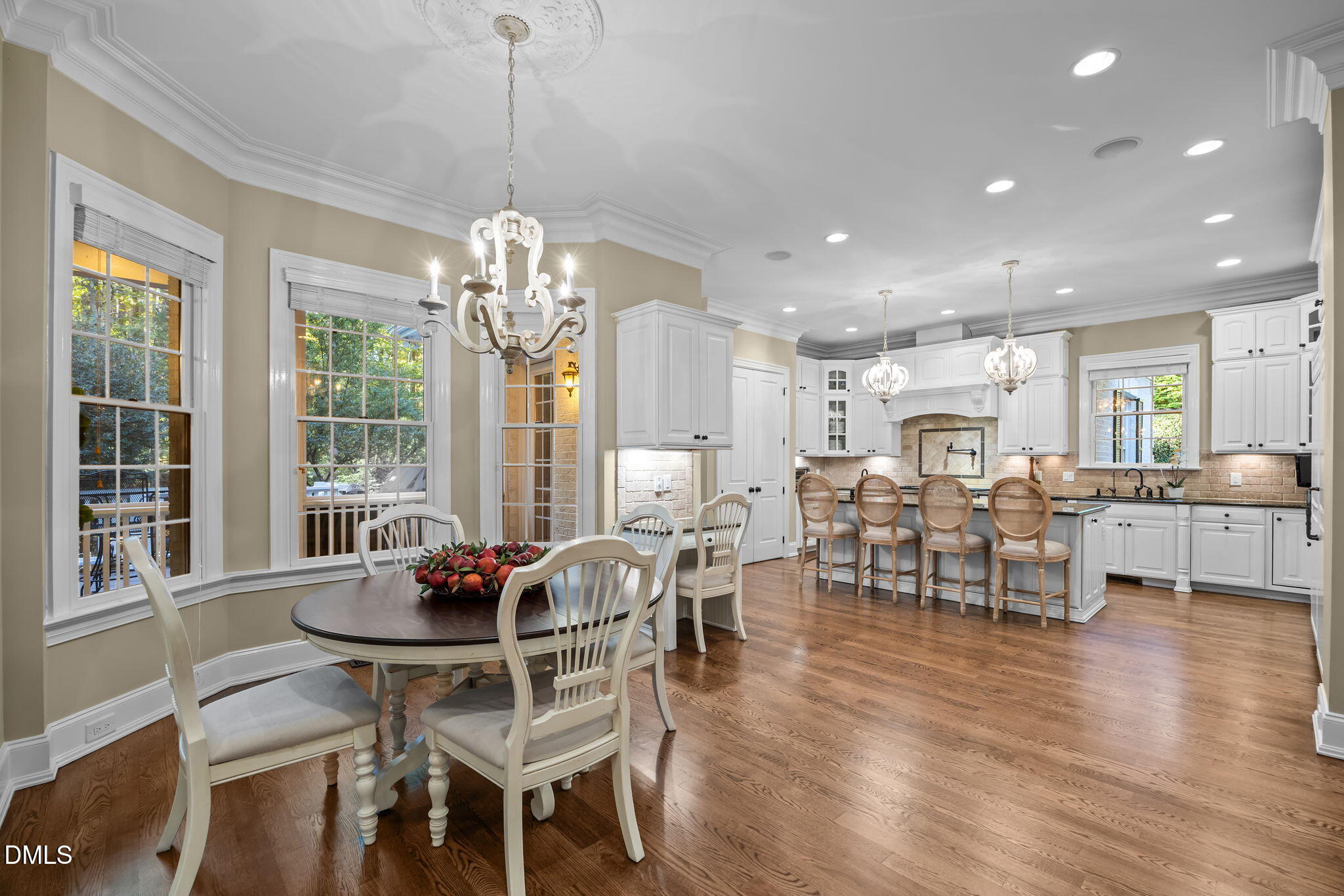 116 Carramore Lane Durham, NC 27705 - Photo 12 of 56 a dining room with furniture a chandelier and wooden floor