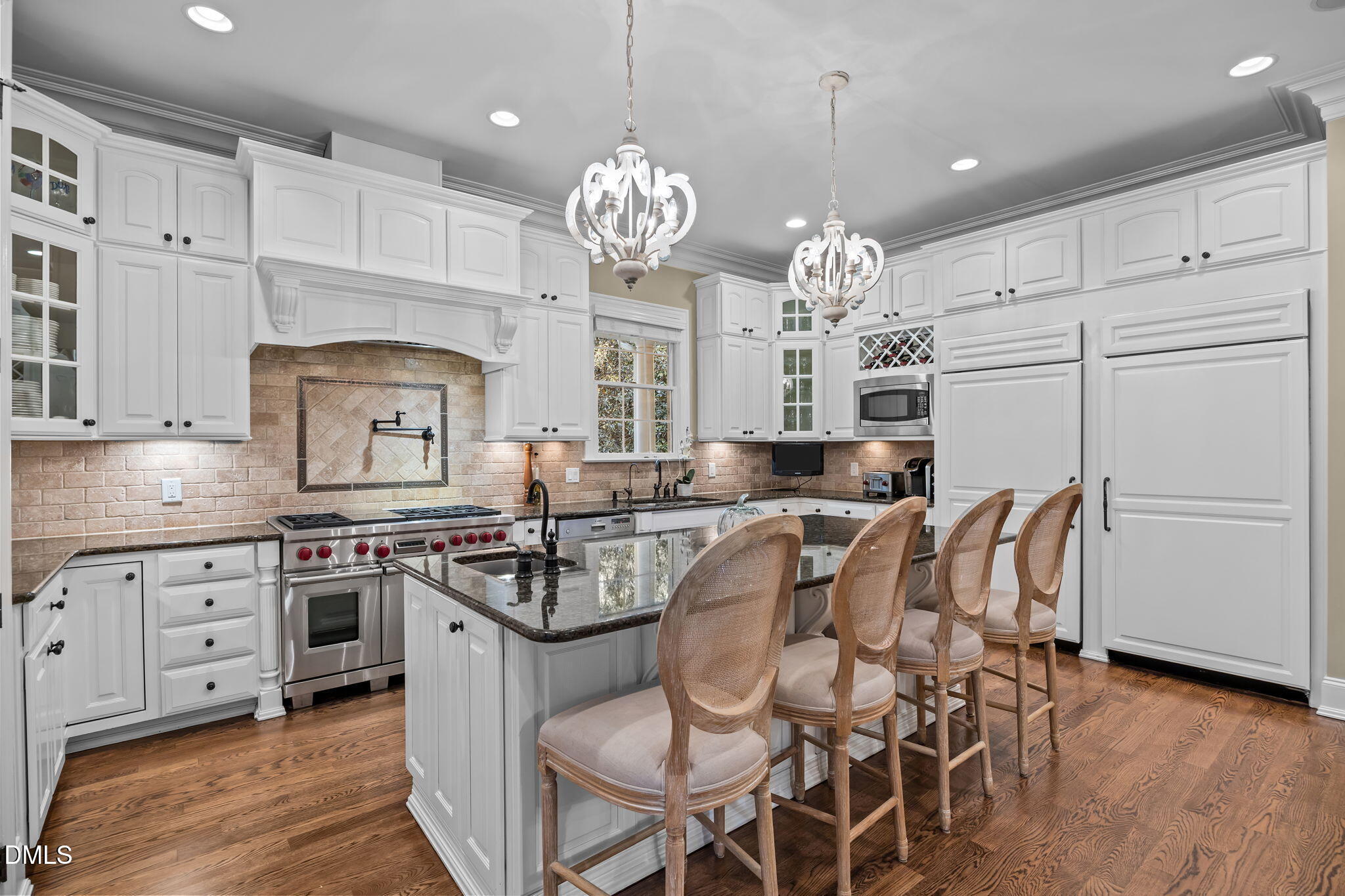 116 Carramore Lane Durham, NC 27705 - Photo 13 of 56 a kitchen with stainless steel appliances granite countertop a stove a sink dishwasher a dining table and chairs with wooden floor
