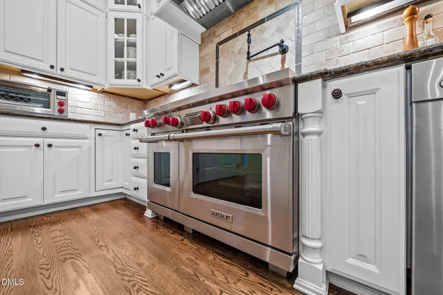 a utility room with sink dryer and washer