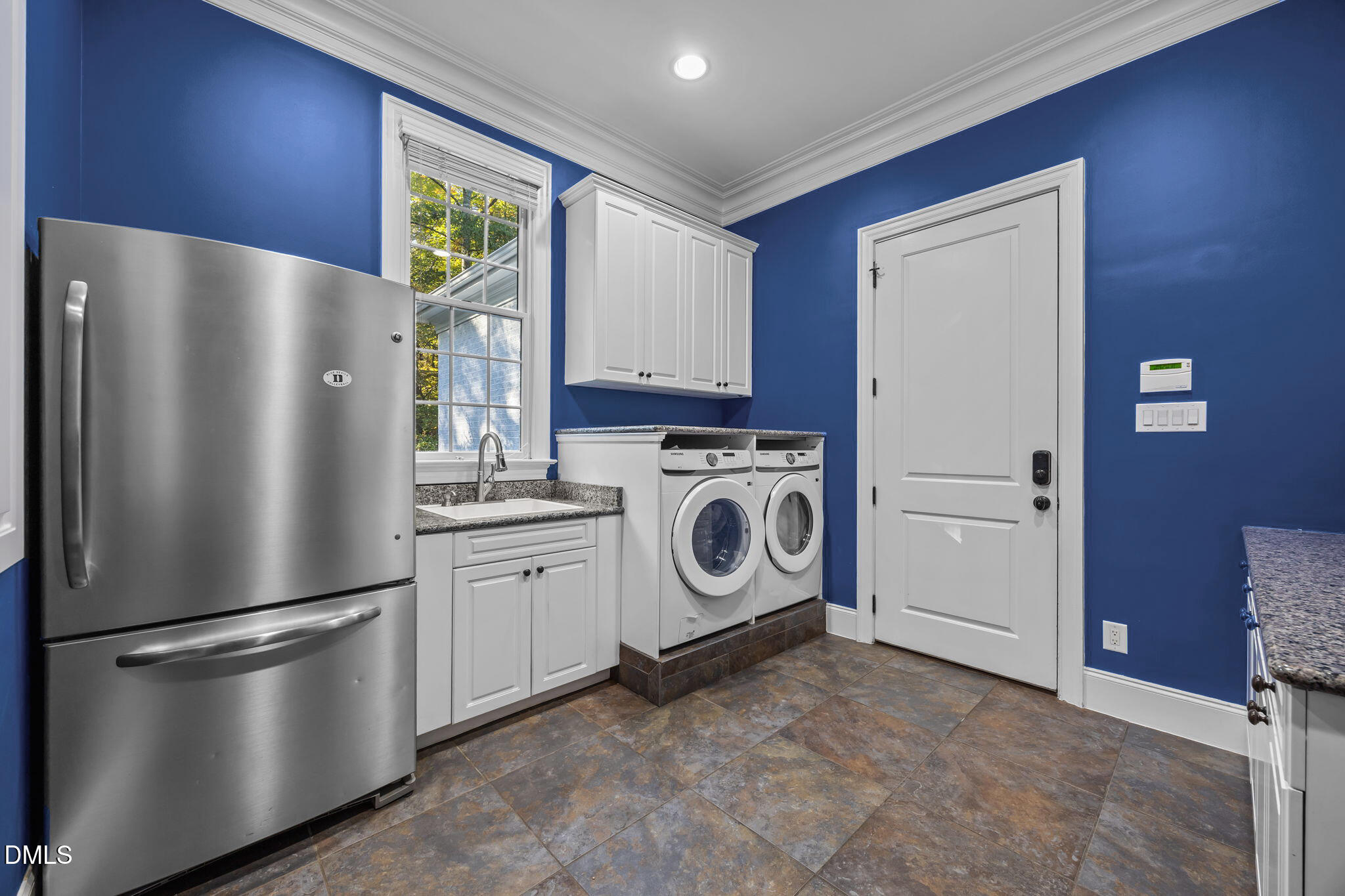 116 Carramore Lane Durham, NC 27705 - Photo 16 of 56 a kitchen with stainless steel appliances a refrigerator sink and stove