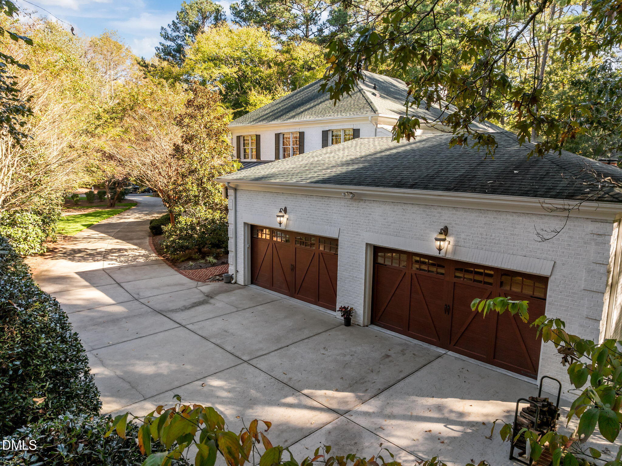 116 Carramore Lane Durham, NC 27705 - Photo 19 of 56 a front view of a house with a yard and garage