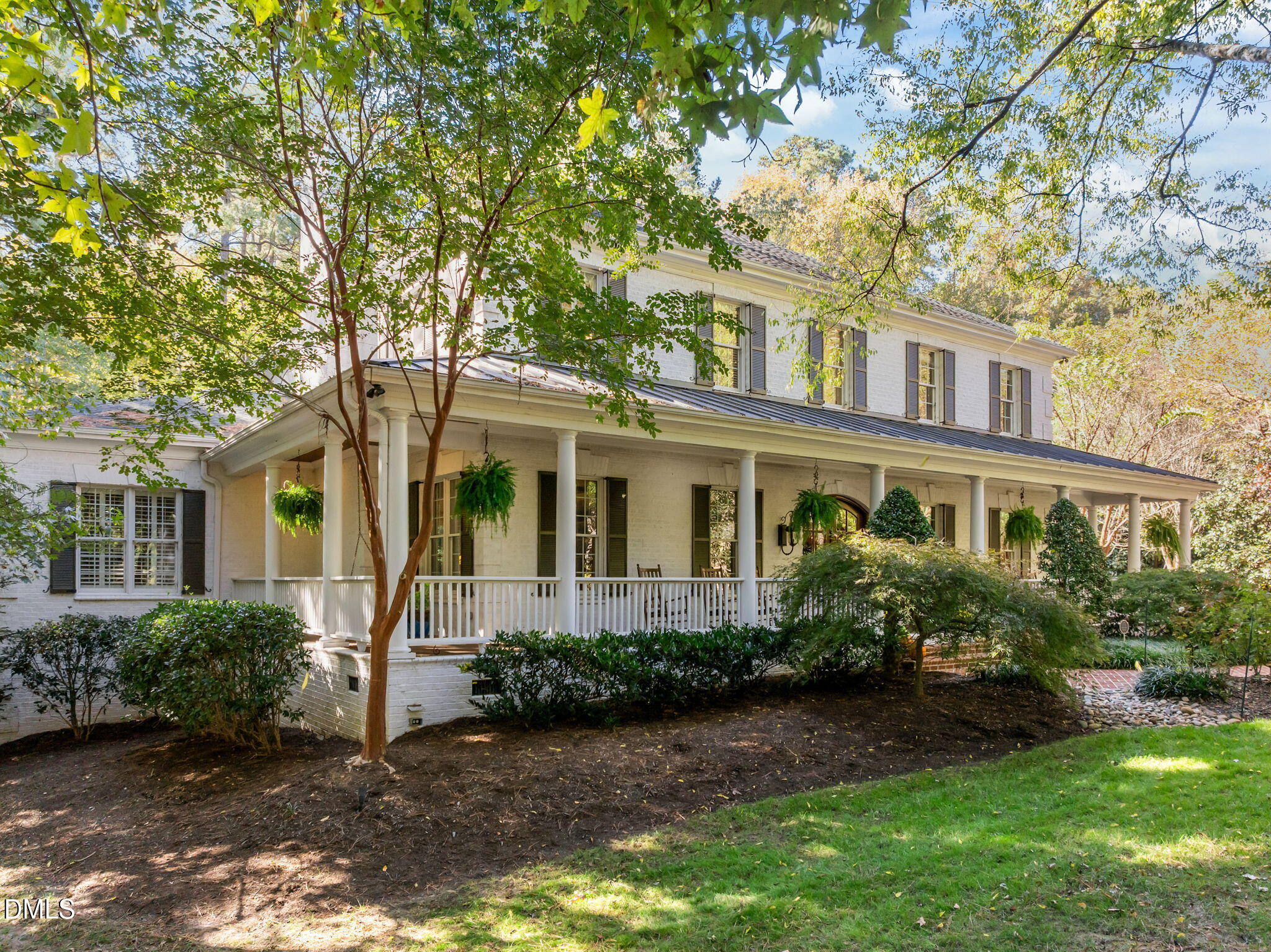116 Carramore Lane Durham, NC 27705 - Photo 22 of 56 a front view of a house with a yard and potted plants
