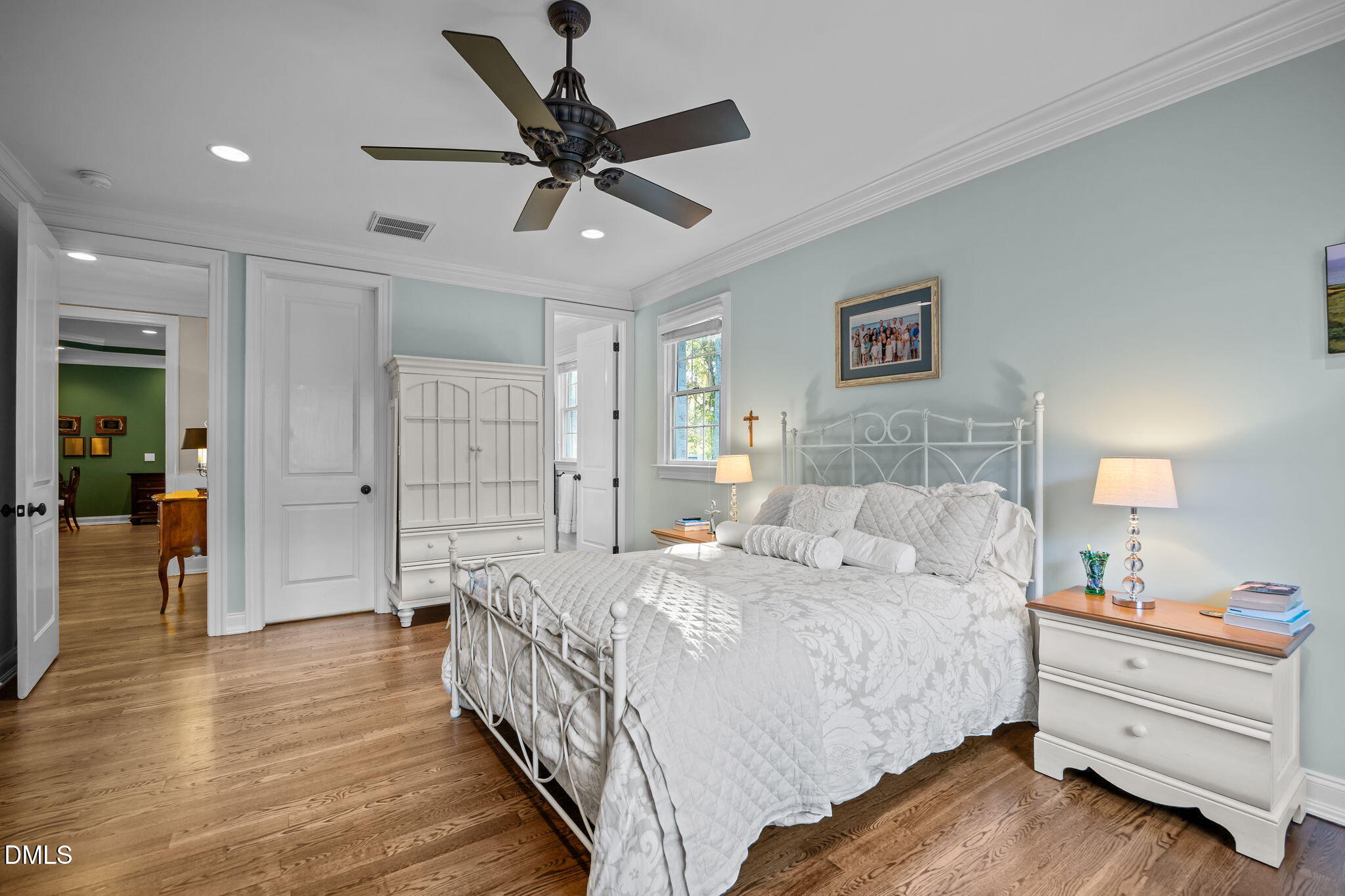 116 Carramore Lane Durham, NC 27705 - Photo 23 of 56 a bedroom with a bed and a chandelier