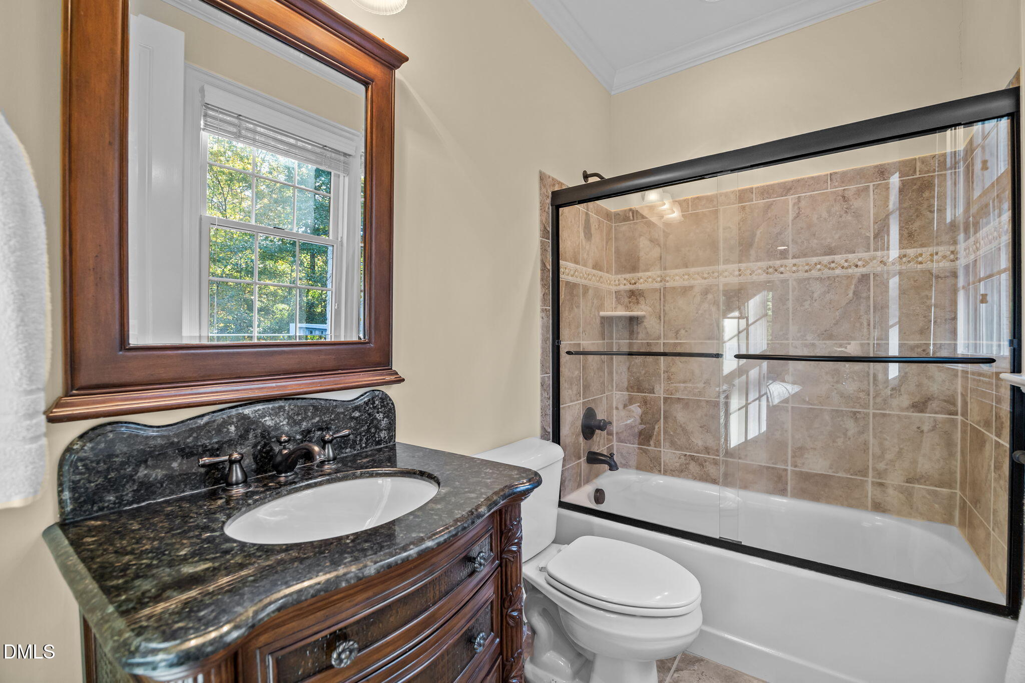 116 Carramore Lane Durham, NC 27705 - Photo 24 of 56 a bathroom with a granite countertop sink toilet a mirror and shower