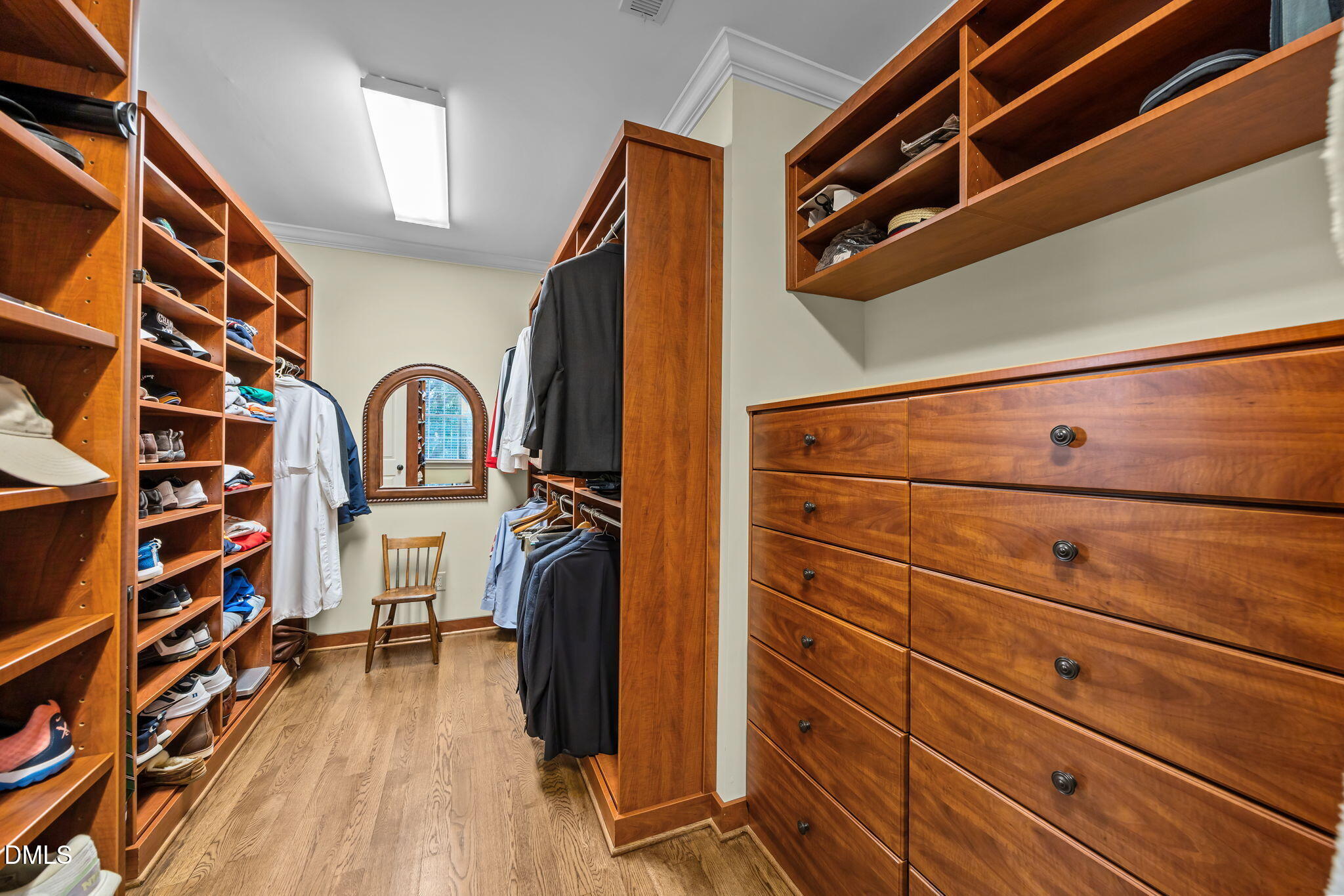 116 Carramore Lane Durham, NC 27705 - Photo 34 of 56 a view of walk in closet with clothes and shoes