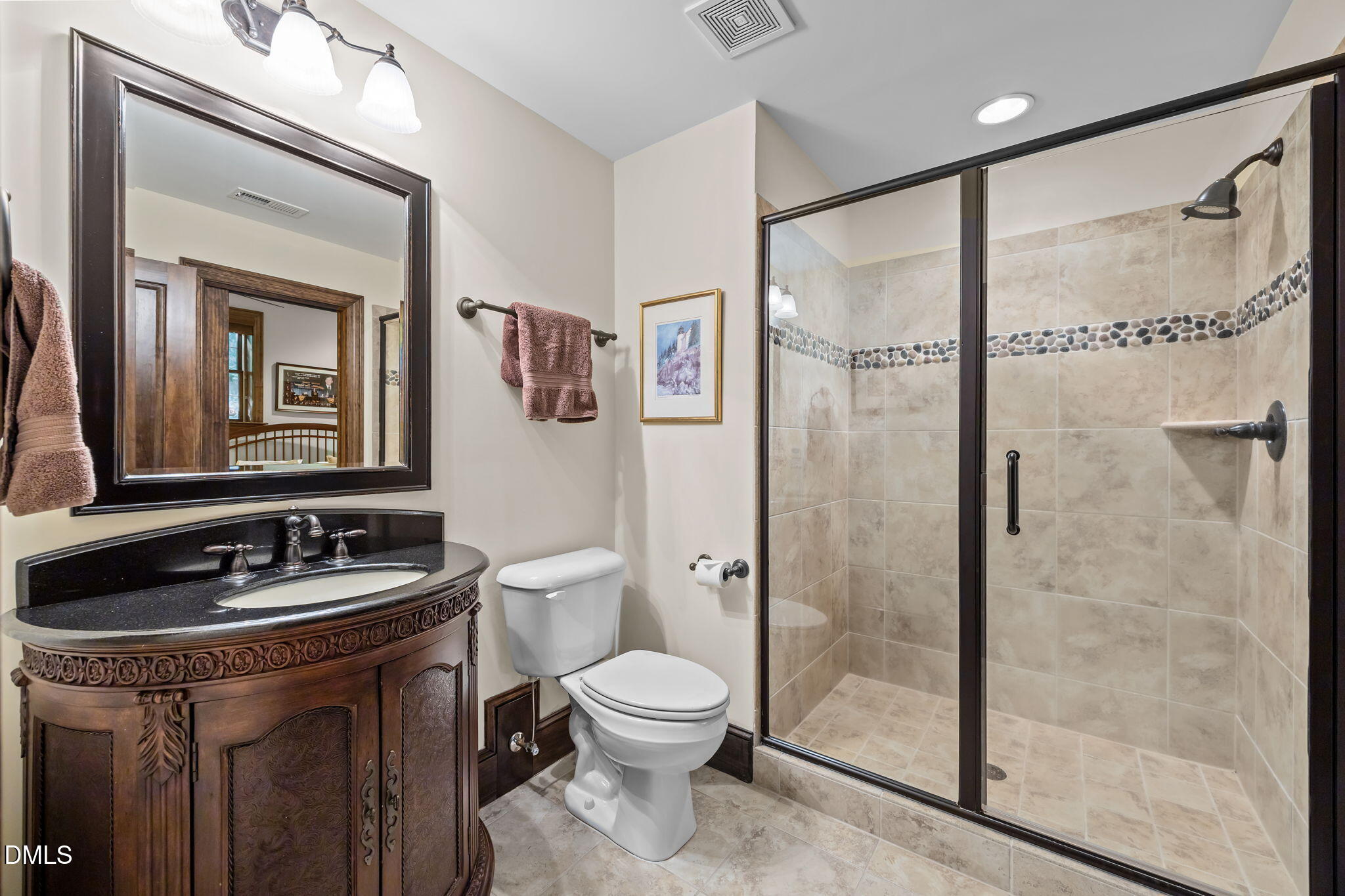 116 Carramore Lane Durham, NC 27705 - Photo 45 of 56 a bathroom with a granite countertop sink toilet a mirror a shower and a mirror