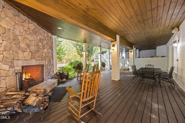 a view of a house with chairs on wooden floor