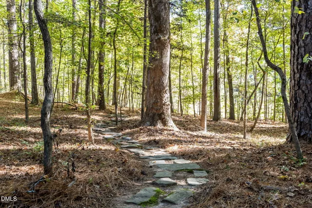 a view of balcony with wooden floor and fence
