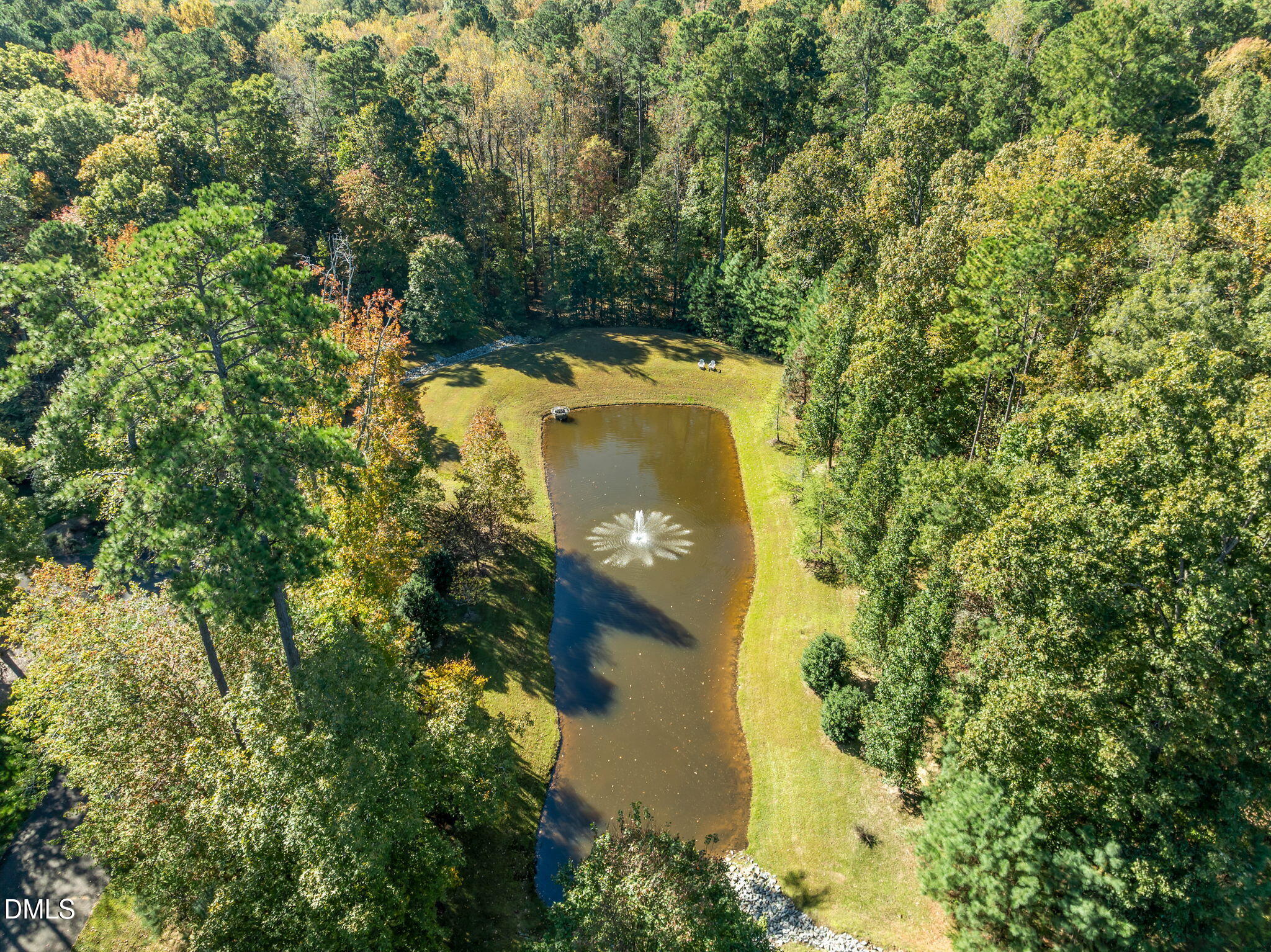 116 Carramore Lane Durham, NC 27705 - Photo 52 of 56 an aerial view of a house with a yard and trees all around