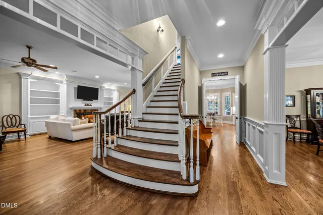 a view of entryway and hall with wooden floor