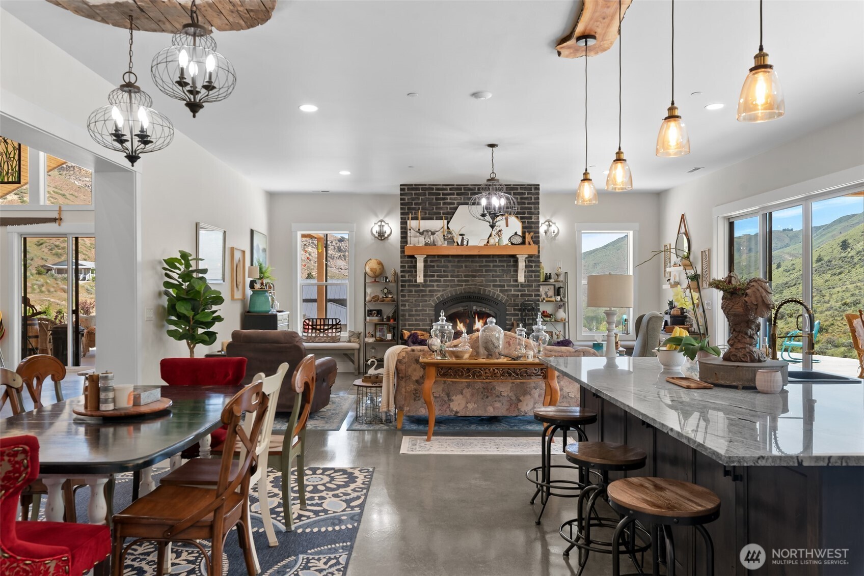 1541 Pitcher Canyon Road Wenatchee, WA 98801 - Photo 14 of 40 a living room with fireplace furniture and a chandelier