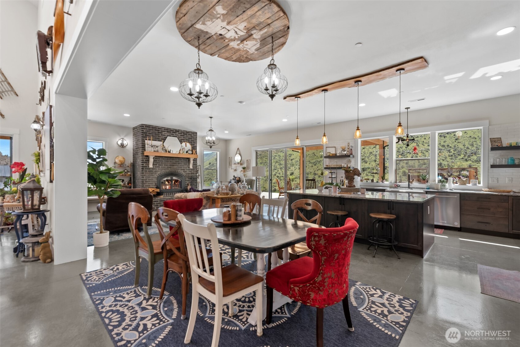 1541 Pitcher Canyon Road Wenatchee, WA 98801 - Photo 20 of 40 a dining room with furniture a rug and a chandelier