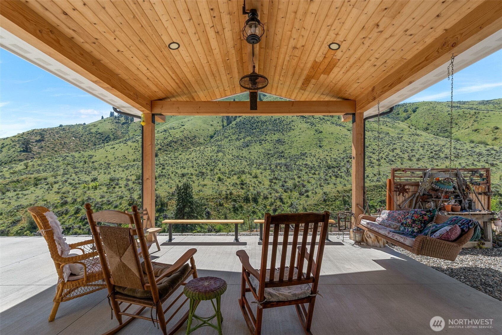 1541 Pitcher Canyon Road Wenatchee, WA 98801 - Photo 36 of 40 a view of a patio with a table chairs and a backyard