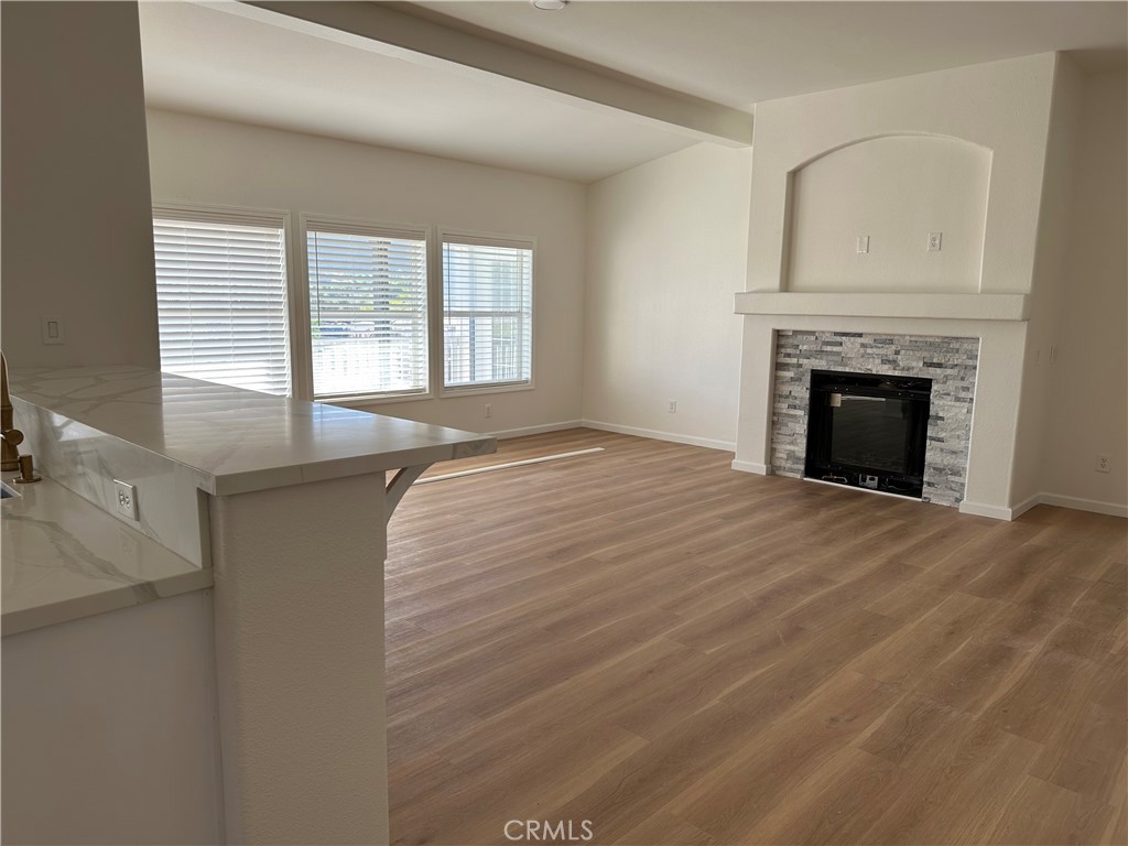 21204 Versaie Perris, CA 92570 - Photo 17 of 33 a view of an empty room with a fireplace and a window