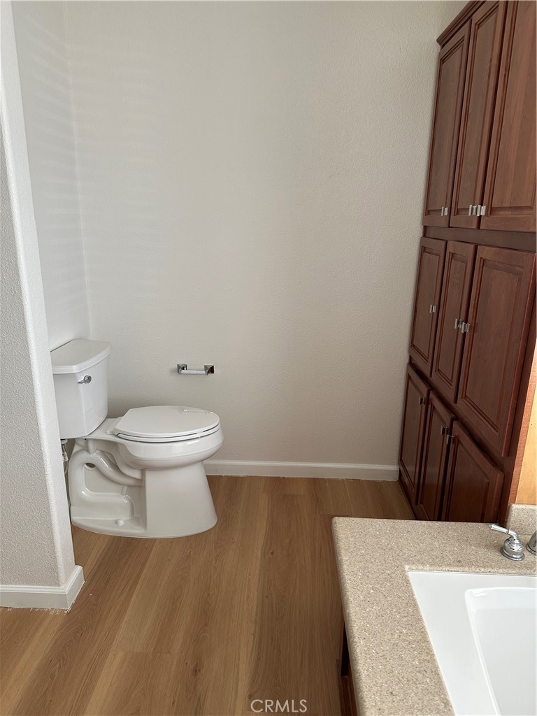 21204 Versaie Perris, CA 92570 - Photo 19 of 33 a bathroom with a sink and a toilet