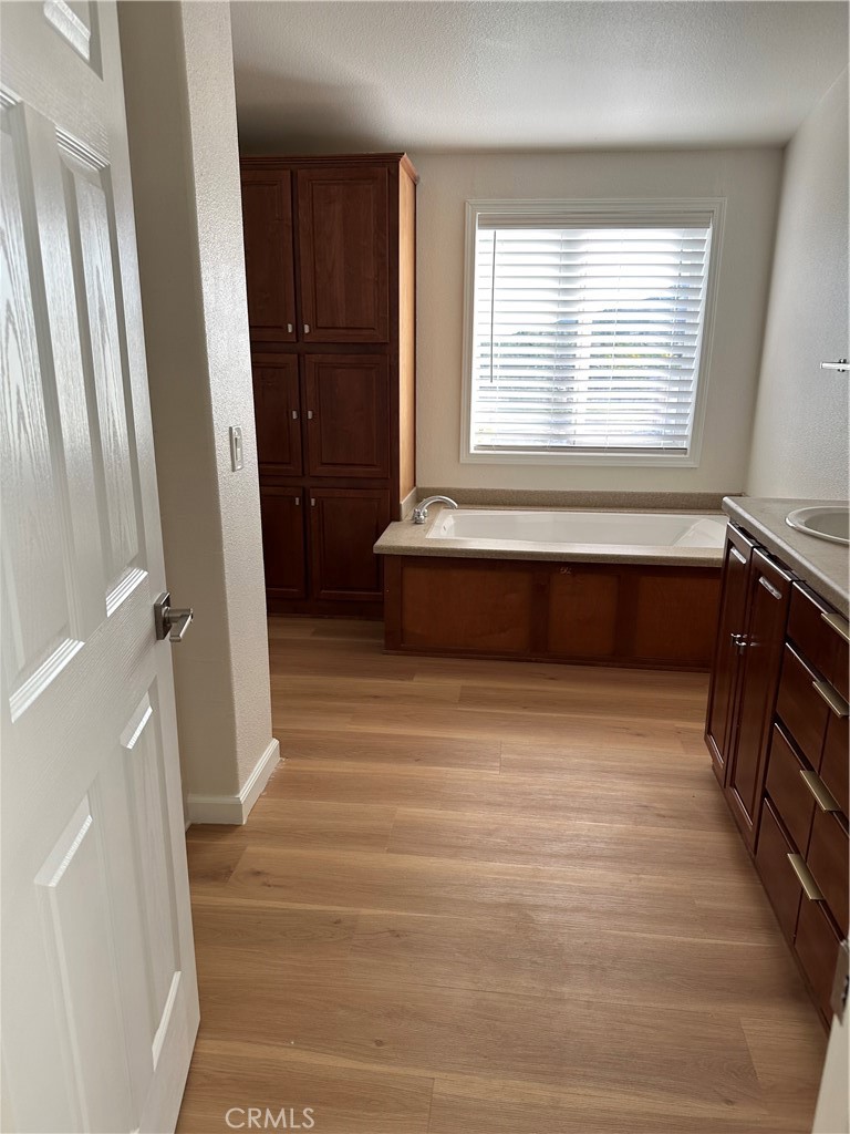 21204 Versaie Perris, CA 92570 - Photo 21 of 33 a bathroom with a bathtub and a window