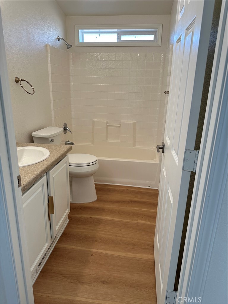 21204 Versaie Perris, CA 92570 - Photo 26 of 33 a bathroom with a sink a toilet and shower
