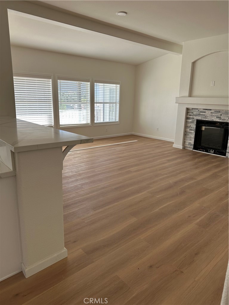 21204 Versaie Perris, CA 92570 - Photo 29 of 33 a view of an empty room with wooden floor and a window