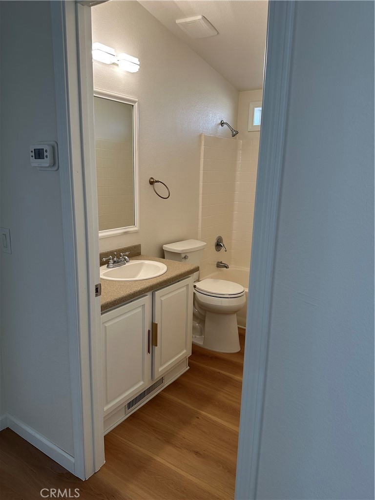 21204 Versaie Perris, CA 92570 - Photo 32 of 33 a bathroom with a granite countertop sink toilet and shower