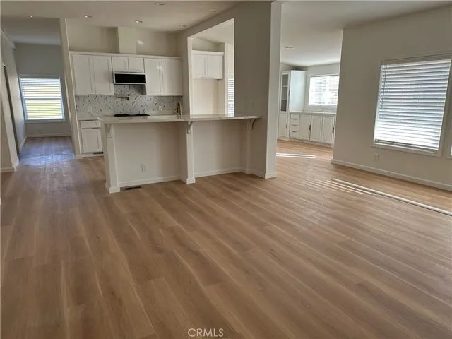 a view of kitchen with wooden floor
