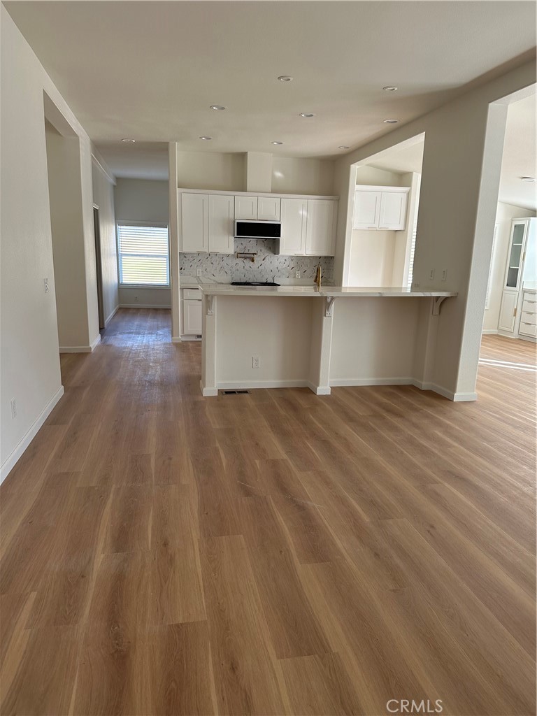 21204 Versaie Perris, CA 92570 - Photo 10 of 33 a view of kitchen with wooden floor