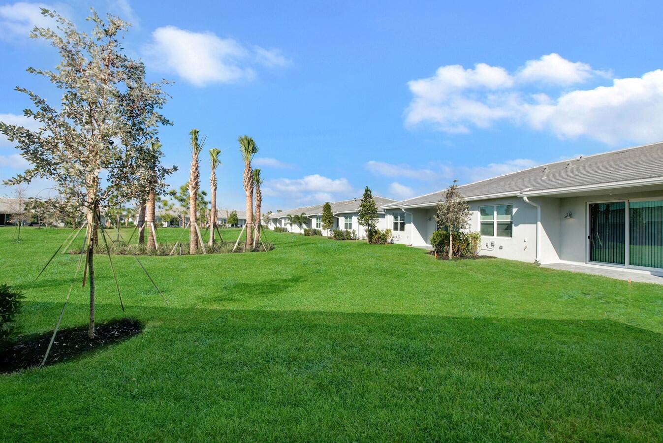14511 Three Ponds Trail Delray Beach, FL 33446 - Photo 13 of 33 a front view of a house with garden
