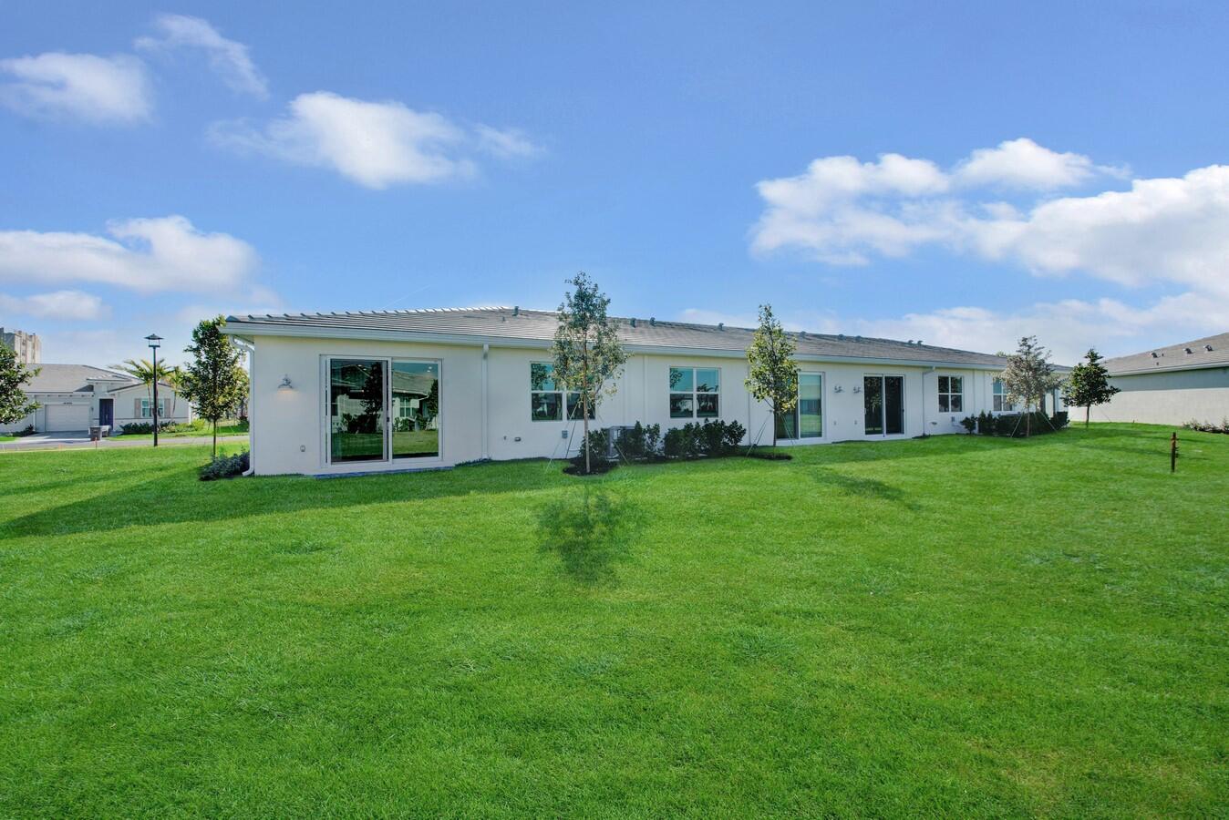 14511 Three Ponds Trail Delray Beach, FL 33446 - Photo 14 of 33 a front view of house with yard and green space
