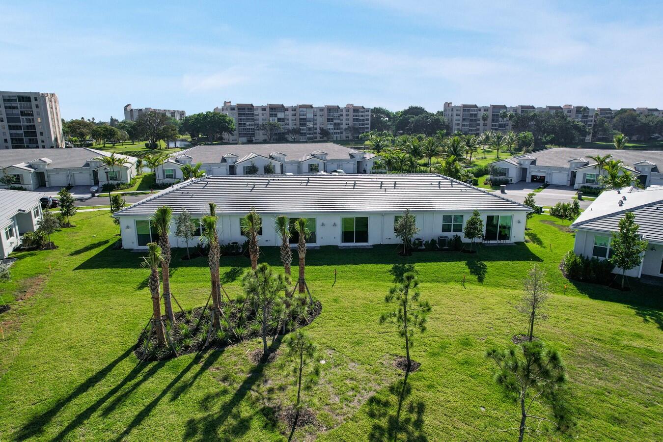 14511 Three Ponds Trail Delray Beach, FL 33446 - Photo 15 of 33 a view of a house with a big yard plants and large trees
