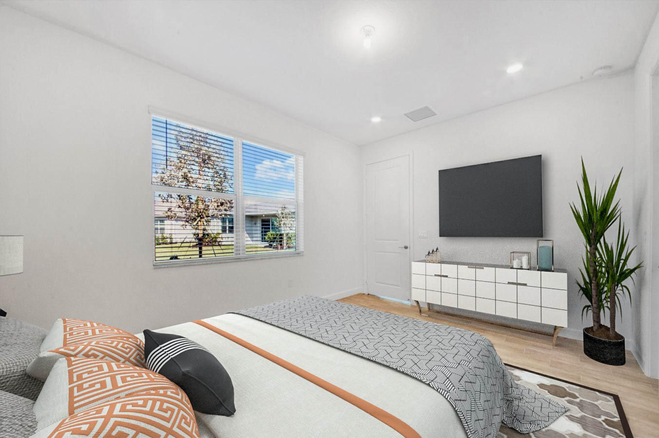 14511 Three Ponds Trail Delray Beach, FL 33446 - Photo 7 of 33 a bedroom with a bed and a flat screen tv