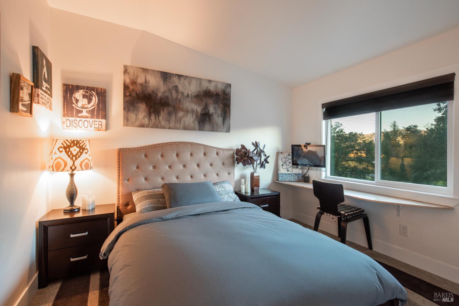 22855 Chianti Road Cloverdale, CA 95425 - Photo 14 of 76 a bedroom with a bed and a large window