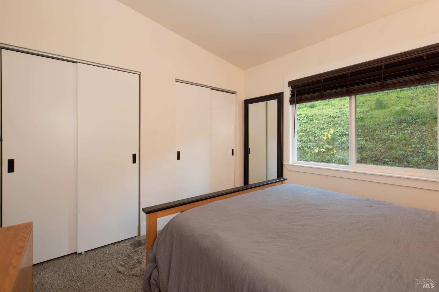 22855 Chianti Road Cloverdale, CA 95425 - Photo 18 of 76 a bedroom with a bed and a large window