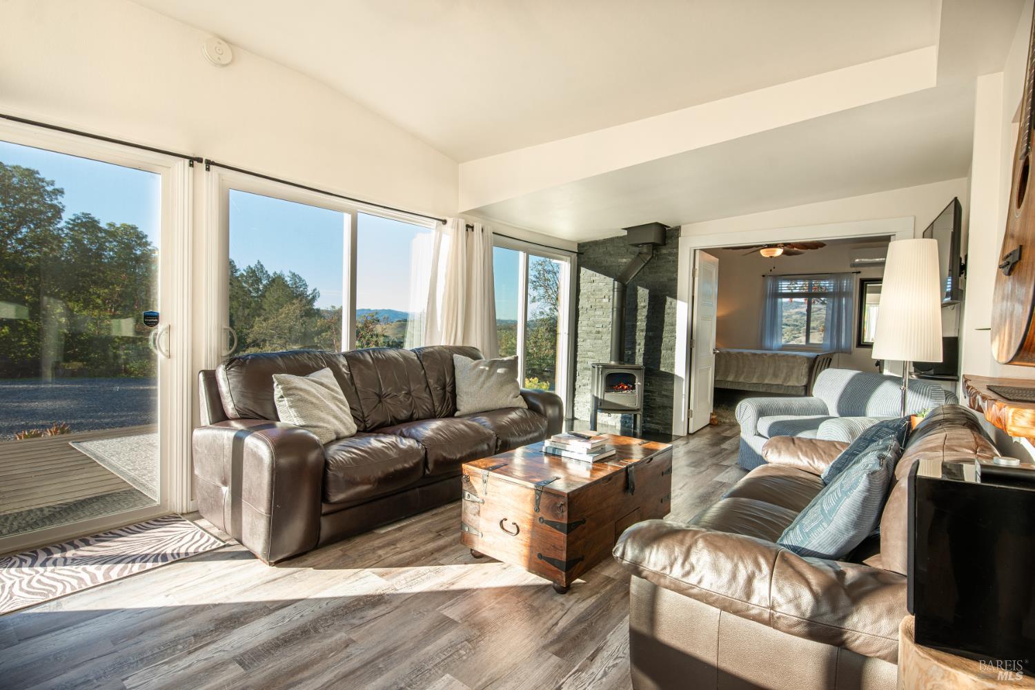 22855 Chianti Road Cloverdale, CA 95425 - Photo 37 of 76 a living room with furniture and a large window