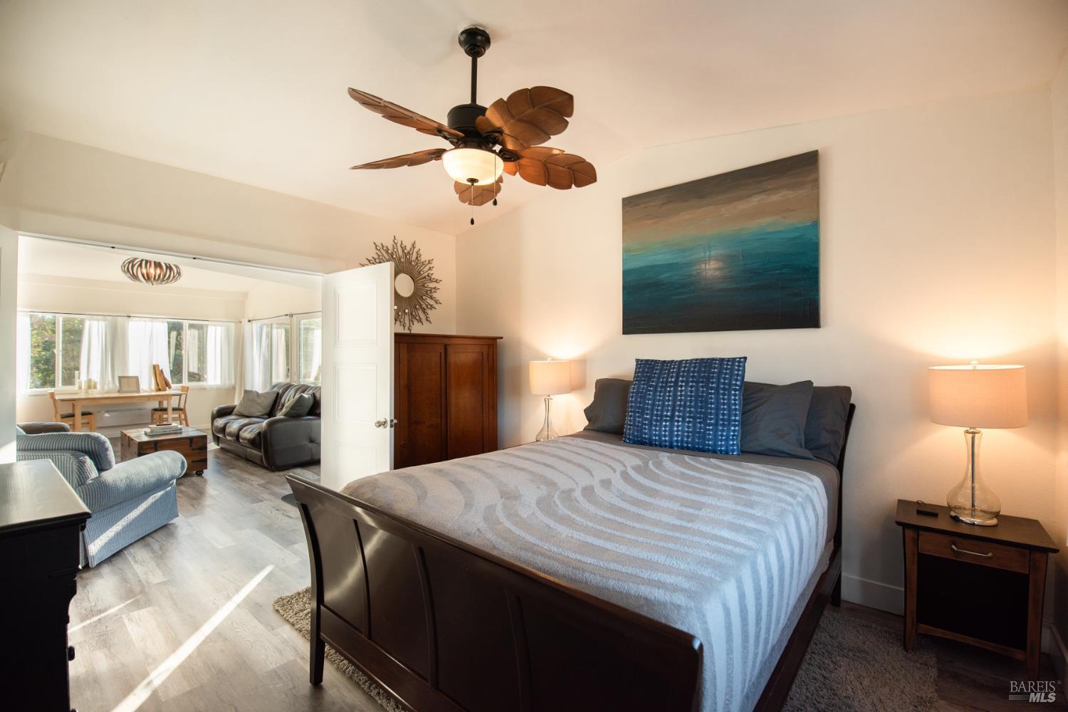22855 Chianti Road Cloverdale, CA 95425 - Photo 41 of 76 a spacious bedroom with a bed and a flat screen tv