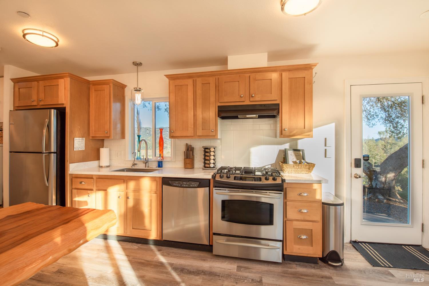 22855 Chianti Road Cloverdale, CA 95425 - Photo 43 of 76 a kitchen with a stove and a refrigerator