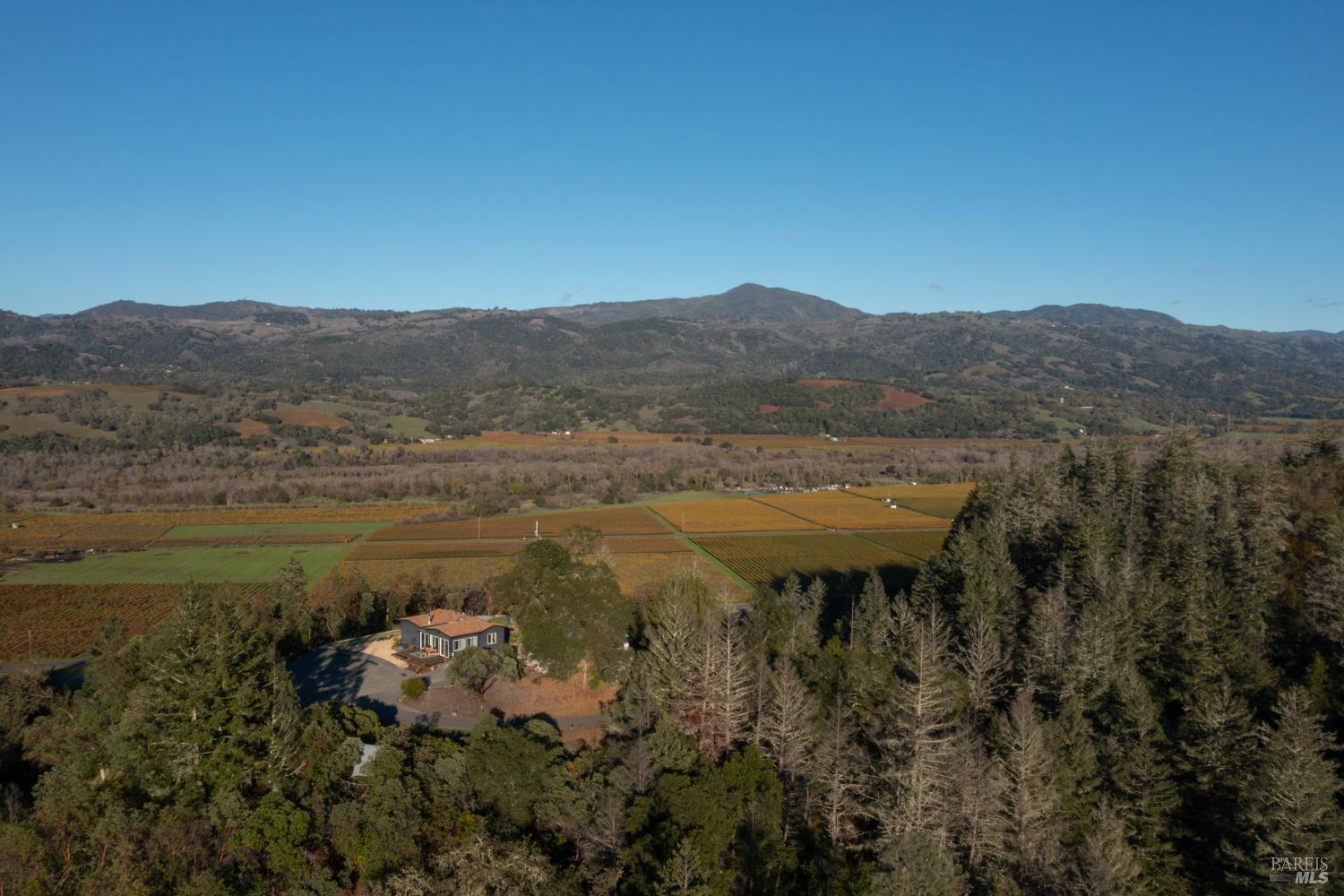 22855 Chianti Road Cloverdale, CA 95425 - Photo 48 of 76 a view of a lake with a mountain in the background