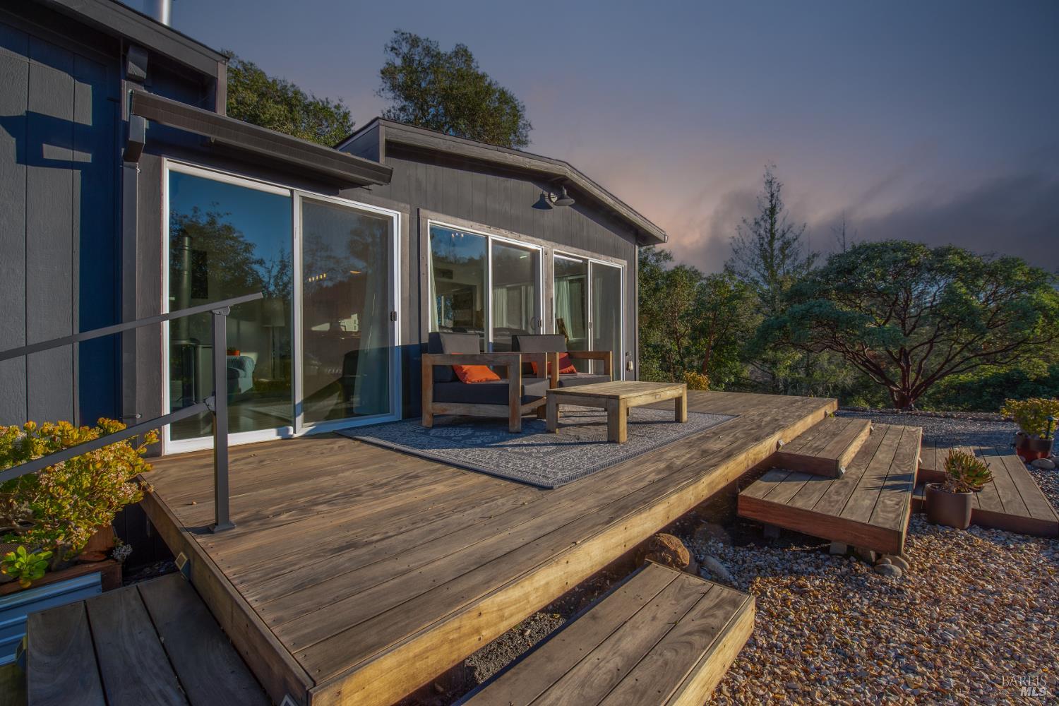 22855 Chianti Road Cloverdale, CA 95425 - Photo 68 of 76 a view of a patio with table and chairs and potted plants