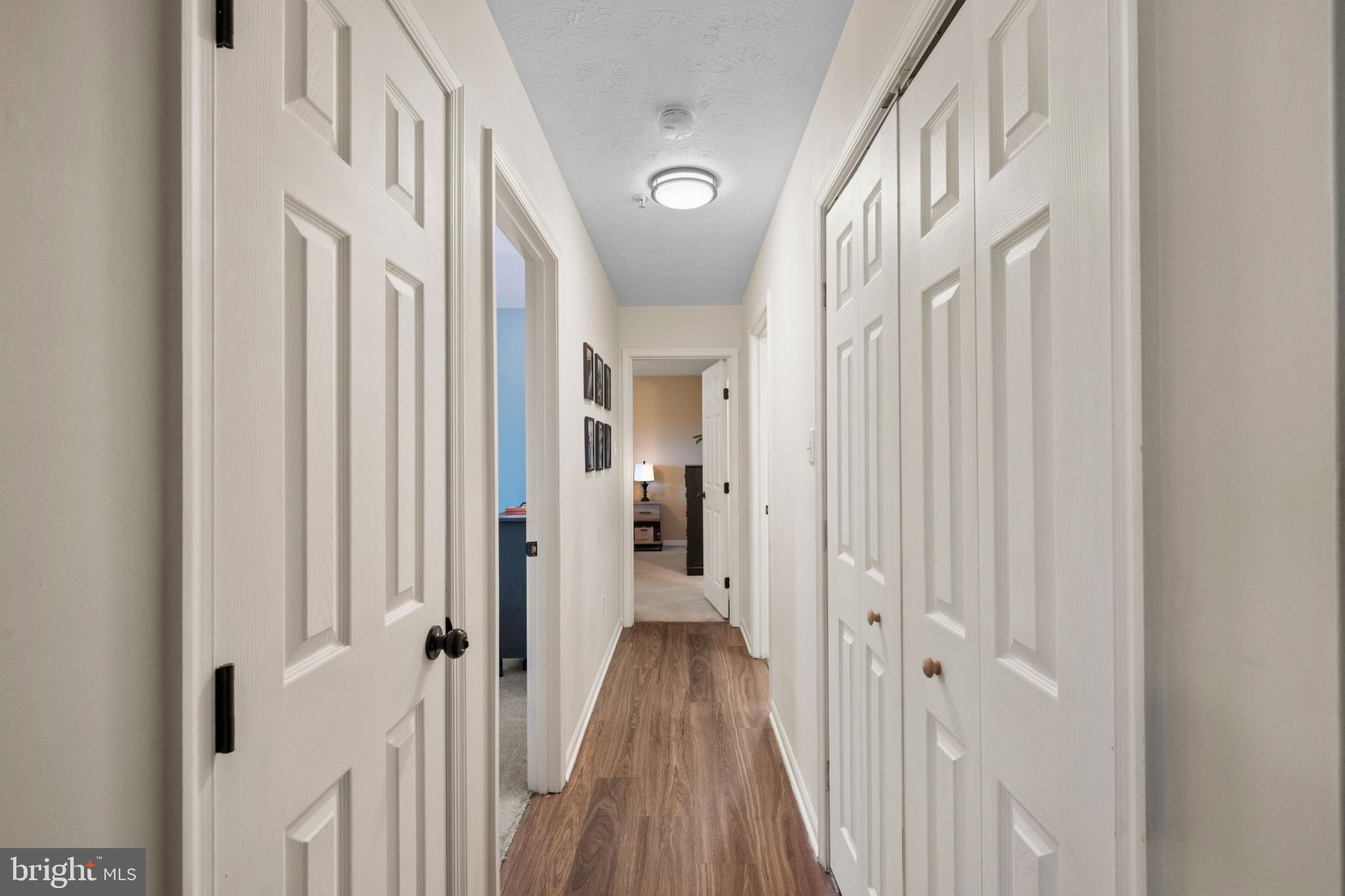 3105 Cardinal Way, Unit L Abingdon, MD 21009 - Photo 19 of 31 a view of a hallway with wooden floor and staircase