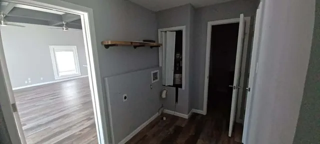 a view of a chair and table in backyard of the house