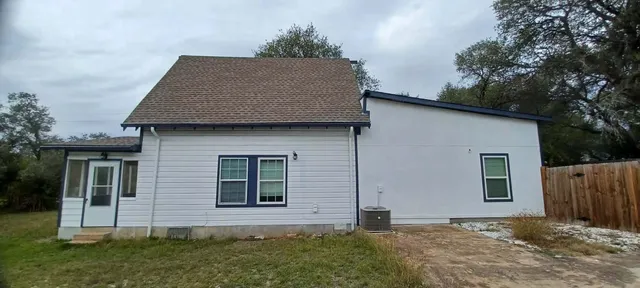 a view of an entryway with wooden floor and stairs