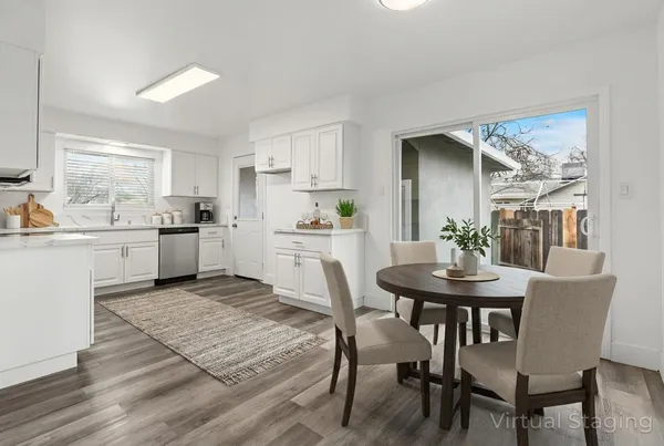 a kitchen with a table and chairs in it
