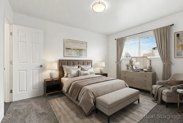 a bedroom with a bed and a couch