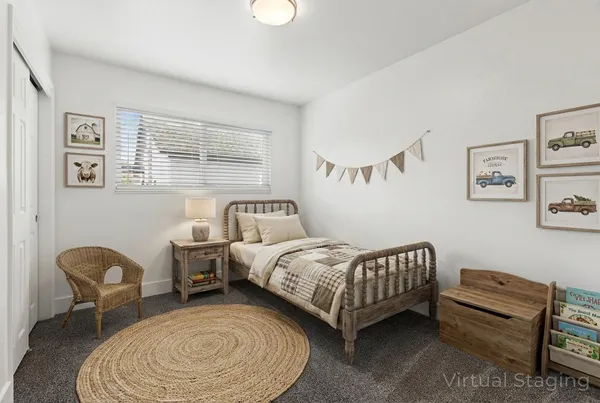 a bedroom with bed and a window