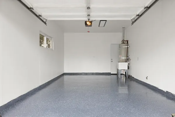 en empty room with a window and a table