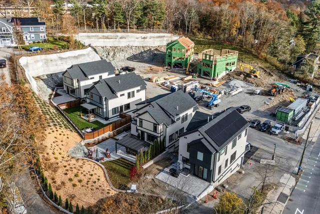 an aerial view of a house with outdoor space