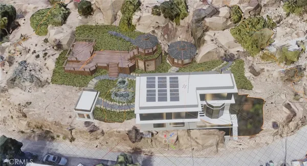 an aerial view of a house with a yard